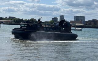 A Royal Navy Landing Craft Air Cushion (Light) (LCAC(L)) hovercraft on water